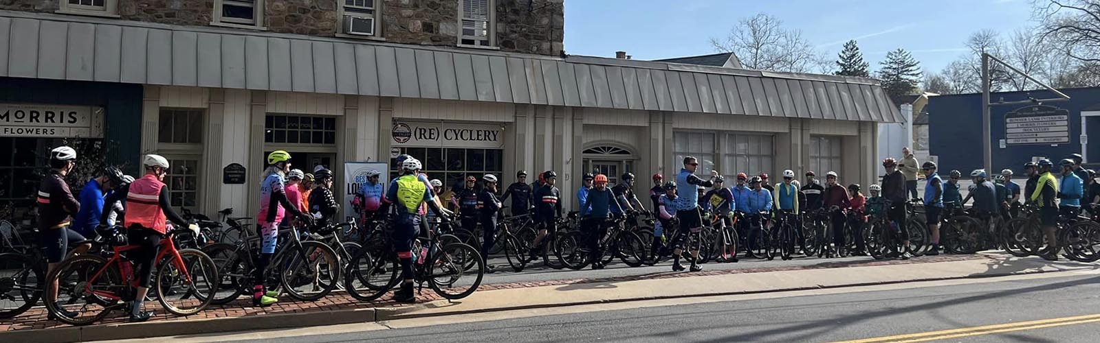 Image of Gravel Bikers in front of the Plum Grove bike shop